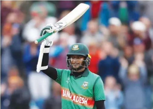  ?? Reuters ?? ↑ Bangladesh’s Shakib Al Hasan celebrates after reaching his century against the West Indies during their World Cup match on Monday.