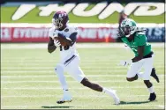  ?? Joe Robbins / Getty Images ?? Eastern Kentucky’s Keyion Dixon (16) catches a pass in front of Marshall’s Steven Gilmore (3) on Sept. 5 in Huntington, W.V.