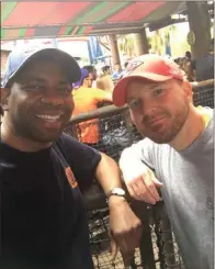  ??  ?? Newell and his friend Josh at Busch Gardens in Tampa last November as they waited to ride the SheiKra Dive Coaster, a 200-foot ride that reaches speeds of up to 70 mph. It includes a splashdown and a loop.