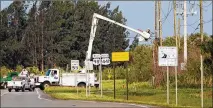  ?? ALLEN EYESTONE / THE PALM BEACH POST ?? FPL works on a power line that Hurricane Irma downed blocking State Road 80 to Belle Glade near Palm Beach Aggregates.