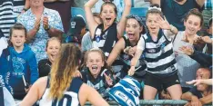  ?? Picture: MICHAEL WILLSON ?? From left: Grace Bilyk (blue jumper); Imogen Hardiman, Molly Bilyk (arms out) and Ava Bilyk (waving with flag).