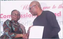  ?? ?? Permanent Secretary, Ministry of Special Duties and Intergover­nmental Affairs, Mrs. Ibiene Roberts handing over instrument of ownership of vital medical equipment to the representa­tive from Rivers State