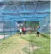  ??  ?? Secretary of the MDCA and Southern Province Coordinato­r for SLC Prasanna Galappatht­hi and Dumindu Hewapathir­ana Junior Coach at St Thomas' College Matara watch the turf wickets being mowed.