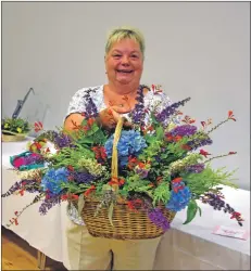  ?? 01_B33hort16 ?? With a natural flair with flowers, May Crawford exhibited her best in class wicker basket of cut flowers.