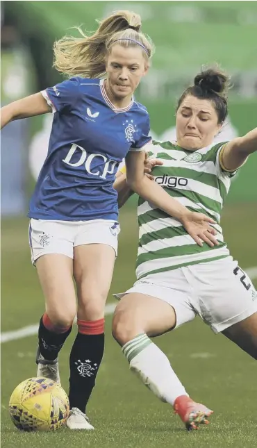  ??  ?? 0 Rangers’ Brogan Hay is tackled by Celtic’s Keeva Keenan during last night’s SWPL1 clash.