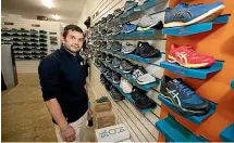  ??  ?? Shoe Clinic owner Nick Bull was busy selling running and walking shoes to customers keen to exercise during level 2.