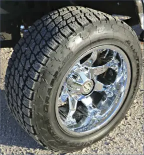  ??  ??  Gibson runs a Nitto Terra Grappler A/TS in a 305/55R20 size mounted on polished chrome, deep-dish 20x12 Fuel Octane wheels. This combo under the reverse shackle front suspension offers a super aggressive looking stance everyone notices coming down the road.