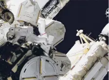  ?? NASA ?? NASA astronauts Victor Glover and Mike Hopkins float on a spacewalk Saturday tackling odd jobs outside the Internatio­nal Space Station.