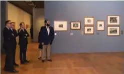  ??  ?? A handout picture shows French President Emmanuel Macron (second right) and Saudi Crown Prince Mohammed bin Salman (right) looking at paintings at Le Louvre museum in Paris.