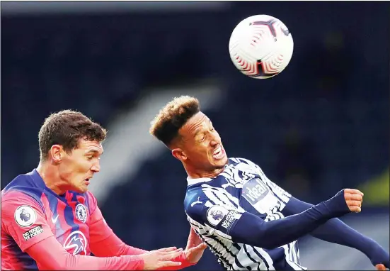  ??  ?? West Bromwich Albion’s Callum Robinson (right), and Chelsea’s Andreas Christense­n head the ball during the English Premier League soccer match between West Bromwich Albion and
Chelsea at the Hawthorns in West Bromwich, England on Sept 26. (AP)