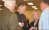  ?? / Diane Wagner ?? County Attorney Wade Hoyt (from left), Commission­er Scotty Hancock, Commission Chair Rhonda Wallace and Manager Jamie McCord discuss the next step during a break in a joint meeting with the City Commission.