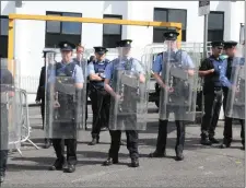  ??  ?? Some of the Gardai on duty with riot gear at Connaughto­n road.