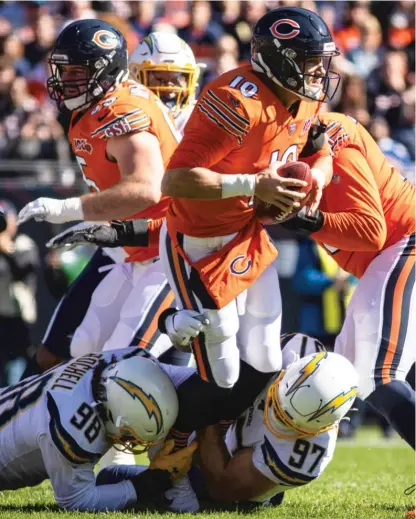  ?? ASHLEE REZIN GARCIA/SUN-TIMES ?? Trubisky (shown being sacked last season by the Chargers) had a subpar 83.0 passer rating in 2019.