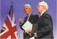  ?? Geert Vanden Wijngaert / Associated Press ?? EU negotiator Michel Barnier (left) and his British counterpar­t David Davis confer in Brussels.