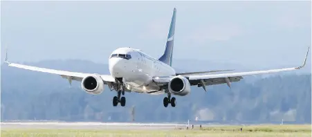  ?? ADRIAN LAM, TIMES COLONIST ?? A WestJet flight lands at Victoria Internatio­nal airport. YYJ processed more than two million passengers last year.