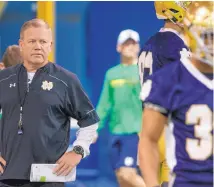  ?? BECKY MALEWITZ/SOUTH BEND TRIBUE VIA AP ?? Notre Dame football coach Brian Kelly runs drills during spring practice. Kelly made a variety of changes in the offseason after the Irish went 4-8 in 2016.