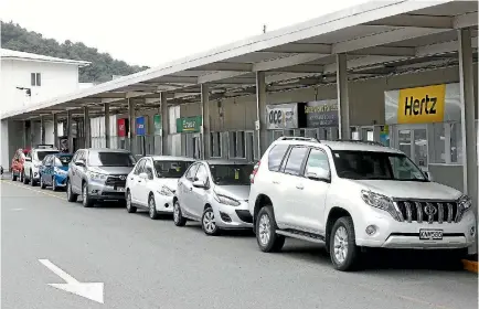  ?? SCOTT HAMMOND/STUFF ?? Car rental companies are having to move out of their single-storey building next to a Picton ferry terminal due to ongoing ground movement following last November’s earthquake.