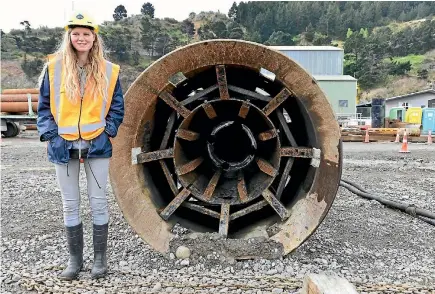  ?? PHOTOS: STEVE DAWSON ?? Researcher Eva Leunissen stands beside pile-driving equipment used to rebuild part of Cashin Quay at Lyttelton Port. Much larger and potentiall­y noisier hammers would be needed for a proposed new cruise berth.