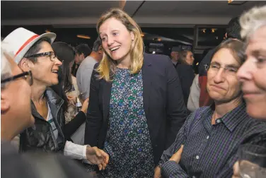  ?? Jessica Christian / The Chronicle ?? California Assembly District 15 candidate Buffy Wicks greets supporters during a campaign election night party at the Golden Squirrel in Oakland. She was running against progressiv­e candidate Jovanka Beckles.