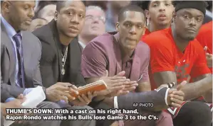  ?? AP PHOTO ?? THUMB’S DOWN: With a cast on his right hand, Rajon Rondo watches his Bulls lose Game 3 to the C’s.