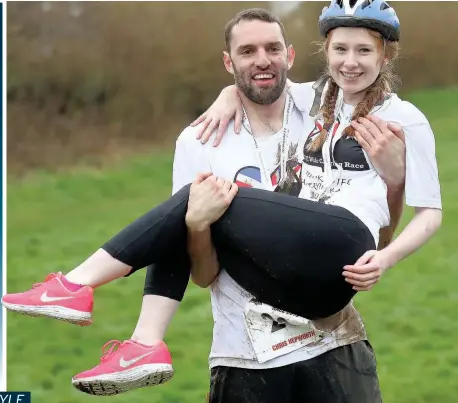  ?? PICTURES: ANDREW MATTHEWS/PA WIRE ?? Chris Hepworth and Tanisha Prince from West Drayton won the 2018 UK Wife Carrying Race