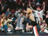  ?? STEVE DYKES/AP ?? Damian Lillard scored 71 points in the Trail Blazers’ 131-114 victory over the Rockets on Sunday, tying three others for the eighth-most points in an NBA game.