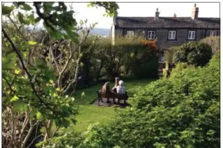  ??  ?? Price’s mom and English aunt sit together in her garden in Huddersfie­ld, Yorkshire — a chance to relax and chat in person that had been in the making for 30years.