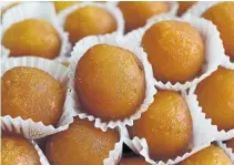  ??  ?? Brar’s dil khushar, top, contains pistachio, cashew and almonds. Gulab jamun, bottom, are milk-based bites drenched in syrup.