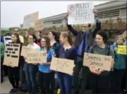  ?? MICHELLE R. SMITH — THE ASSOCIATED PRESS ?? Protesters gather outside a meeting where a climate change report was to be released, Monday in Providence, R.I.