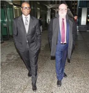  ?? PETER J THOMPSON / NATIONAL POST ?? Judge Donald McLeod, left, seen Friday with his lawyer, is the subject of a Judicial Council hearing into his volunteer work with the Federation of Black Canadians.