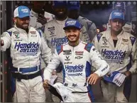  ?? Buda Mendes / Getty Images ?? Kyle Larson and crew walk onstage during driver intros prior to the NASCAR Cup Series All-Star Race at Texas Motor Speedway on May 22.