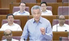  ?? — Reuters ?? Singapore Prime Minister Lee Hsien Loong speaks at a special sitting of parliament on Monday.