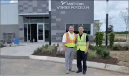  ?? PAUL WELITZKIN / CHINA DAILY ?? Above: Michael Kephart, president of American Wonder Porcelain and Jianping Huang, chairman and president of The Wonderful Group, outside of the American Wonder Porcelain plant in Lebanon, Tennessee.