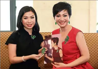  ??  ?? Dazzling adornments: Hui Cin (left) and Winnie showing jewellery worn by Yeoh in the film.