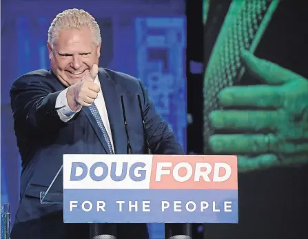  ?? NATHAN DENETTE THE CANADIAN PRESS ?? Doug Ford celebrates in Toronto after winning the Ontario provincial election to become the new premier.