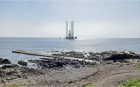  ?? ?? SETTING SAIL: The massive Noble Innovator oil rig had been berthed at Aberdeen’s South Harbour since February.