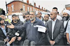  ??  ?? Guiding light: Jahan appeals for calm in Winson Green, Birmingham, after his son’s death