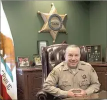  ?? Robin Abcarian Los Angeles Times ?? SHERIFF Alex Villanueva poses for a portrait in his office.