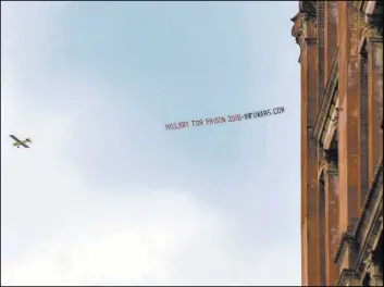  ?? BENJAMIN HAGER/LAS VEGAS REVIEW-JOURNAL ?? An anti-Hillary Clinton advertisem­ent flies over downtown Philadelph­ia on Saturday.