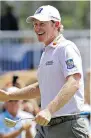  ?? THE ASSOCIATED PRESS ?? Brandt Snedeker grins after sinking a birdie putt on the ninth hole at the Wyndham Championsh­ip on Thursday.