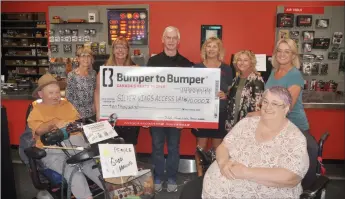  ?? Photo by Matthew Liebenberg/Prairie Post ?? The $10,000 cheque presentati­on took place at Bumper to Bumper Great West Auto Electric, Sept. 13. Back row, from left to right, The Meadows Auxiliary President Eunice Morck, Bumper to Bumper Great West Auto Electric co-owners Leanne Tuntland-Wiebe, Randy Wiebe and Sharon Walde, and SWAVI representa­tives Tracey Schlamp and Karen Wiens. At front, from left, The Meadows residents Thomas Stroud and Anita Penner.