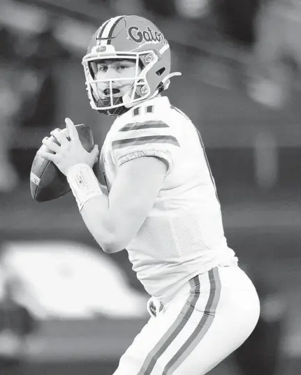  ?? RONALD MARTINEZ/GETTY ?? UF quarterbac­k Kyle Trask led the nation with 43 touchdowns passes and 4,283 passing yards.