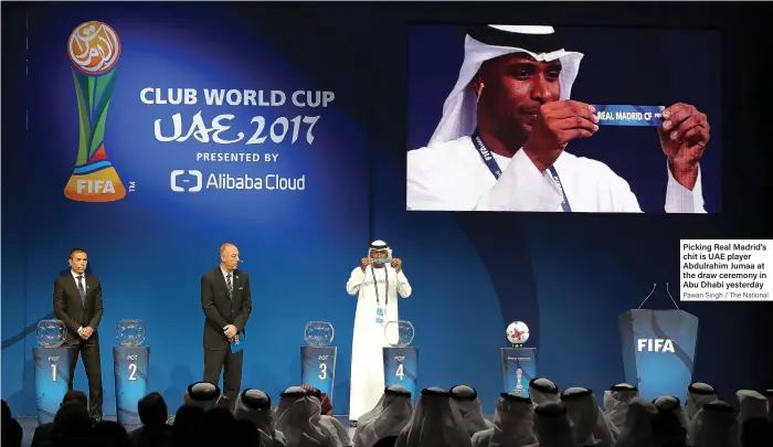  ?? Pawan Singh / The National ?? Picking Real Madrid’s chit is UAE player Abdulrahim Jumaa at the draw ceremony in Abu Dhabi yesterday