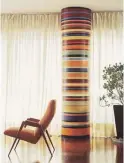  ??  ?? Brightly striped wallpaper changes the perspectiv­e in this condo space and makes a big design statement.