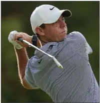  ?? (AP/Julio Cortez) ?? Rory McIlroy shot an 8-under 64 and shares the lead with Sam Burns and Jon Rahm after Thursday’s opening round of the BMW Championsh­ip at Caves Valley Golf Club in Owings Mills, Md.