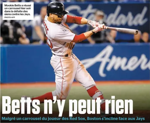  ?? PHOTO AFP ?? Mookie Betts a réussi un carrousel hier soir dans la défaite des siens contre les Jays.