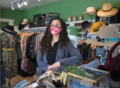  ??  ?? Kristin Facciolini, owner of MODA, stands for a portrait Tuesday (March 23) at her clothing store on Bent Street.