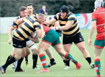  ?? Picture: Phillipa Hilton ?? Canterbury’s Jim Green powers through with team-mate Sam Kelly (right) in support, against Broadstree­t in National League 2 South on Saturday