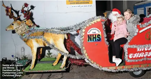  ?? ?? Santa with Lauren and Minnie Davidson on the Humberston Lions Christmas Sleigh