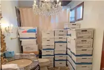  ?? FILE PHOTO BY THE JUSTICE DEPARTMENT VIA AP ?? Boxes of records are stored in a bathroom and shower in the Lake Room at Trump’s Mar-a-Lago estate in Palm Beach, Fla.